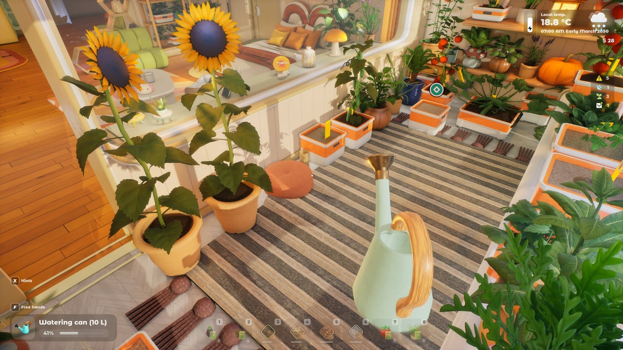 Wide view of a Tiny Eden indoor farm filling an apartment living space with shelves of plants